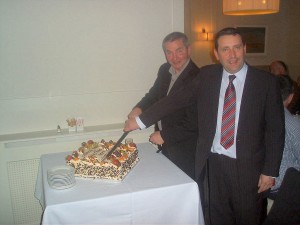 Oliver O'Reilly & Fanahan Colbert cut the cake for the club 40th anniversary celebration.