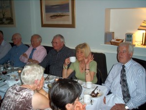  Guests attending the 35th anniversary dinner on May 7th 2005. From left, John Mulvey, John Quirke (the longest ever serving club member) and J.J. Bunyan, all former Club Presidents. Waving to the camera is Olive Corcoran, a then active club member who was to go on to serve as the last Mayor of Fermoy before the Town Council was abolished under local government reforms. Extreme right is another former Club President John Kelly, who because of changes of procedure introduced by World Headquarters, held the office for longer than anyone else, a period of eighteen months from the beginning of 1991 to mid-1992. Between them all, here represented are a brilliant constellation of talent and commitment and dedication to Fermoy Toastmasters. 