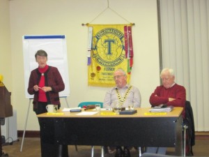 At the meeting of November 17th, 2015, at the Fermoy Youth Centre, our Toastmaster and coordinator, Eilish Ui Bhriain, guides proceedings along with charm and grace, always including now and then a few aptly-chosen words of her beloved Irish language. In the background can be seen the Club Banner, which was issued to us by World Headquarters in 1970, a powerful symbol of ntinuity of all of our activities promoting the arts of communication and leadership and personal growth for the greater part of half a century. It is a very fine record to which so many members, both past and present, have contributed with such great generosity of spirit, and of which all can be so rightly proud. 