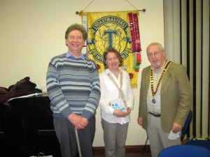 Club President John Sherlock congratulates Kevin Walsh and Mary Whelan, winners of the annual Club Speech & Evaluations Contests.