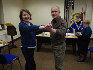  Mary Whelan and Kevin O'Neill prepare to jive as part of Kevin's speech about dancing at the April 25th meeting. Warm smiles speak volumes of how much this occasion was being so much enjoyed with the very greatest pleasure shared by all.