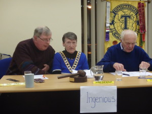  An interesting study of facial expressions of the Top Table with Eilish Ui Bhriain, Club President, with Toastmaster of the evening, Jerry Hennessy (left) and John Quirke who gave us a scintillating topics session. The legend on the sign proclaims 'Ingenious', the word of the night which members are invited to include in their contributions and speeches. 